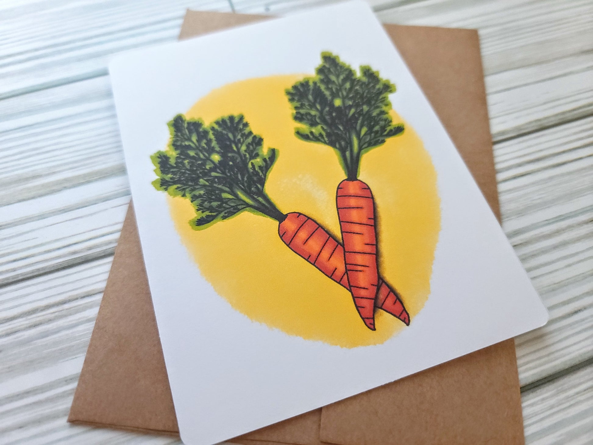 Carrot Handmade Greeting Card - Recycled Paper and Kraft Envelope - Angled Overhead Shot