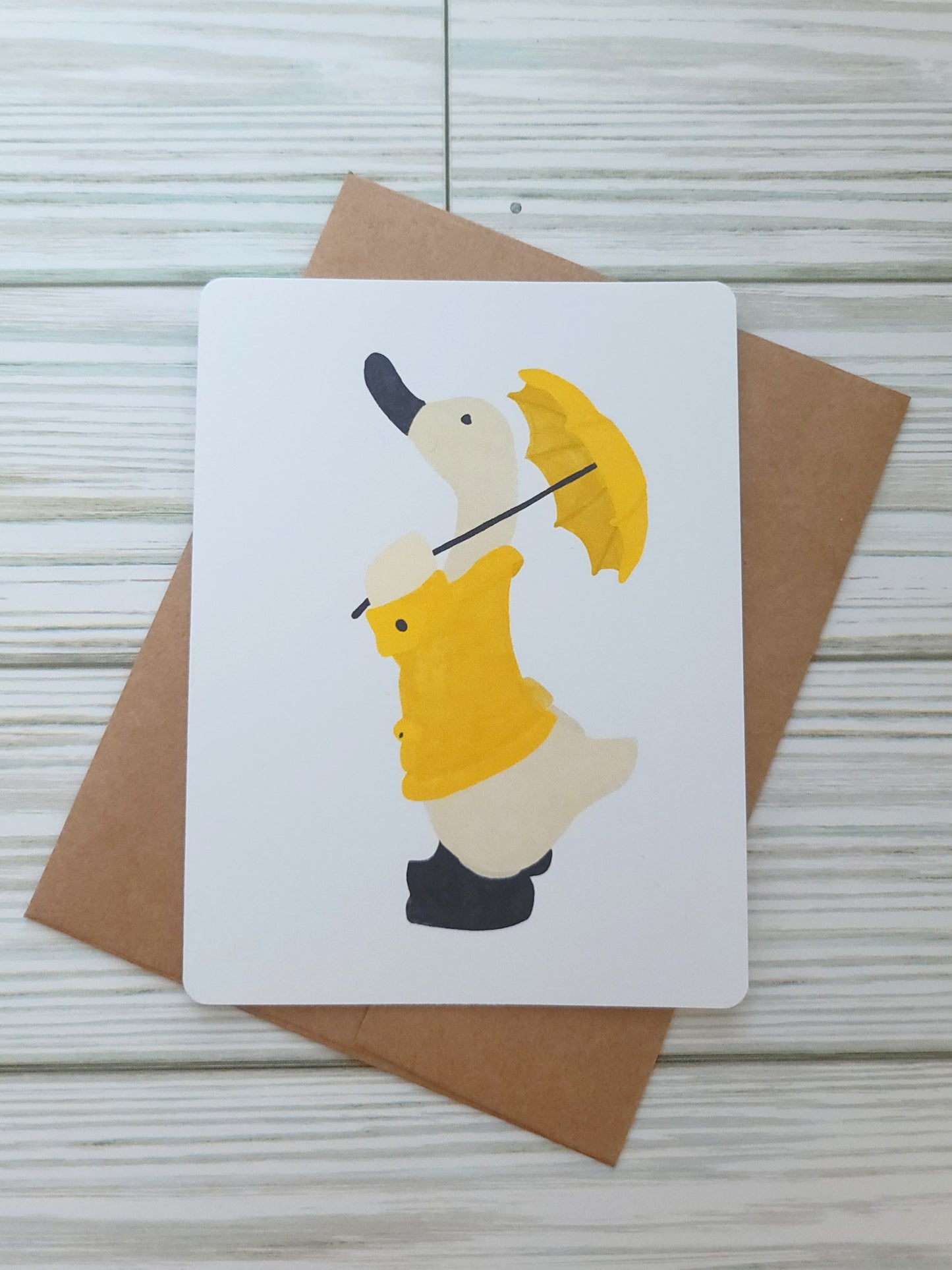 Duck in a Yellow Rainjacket with Umbrella Handmade Greeting Card - Recycled Paper and Kraft Envelope - Overhead Shot