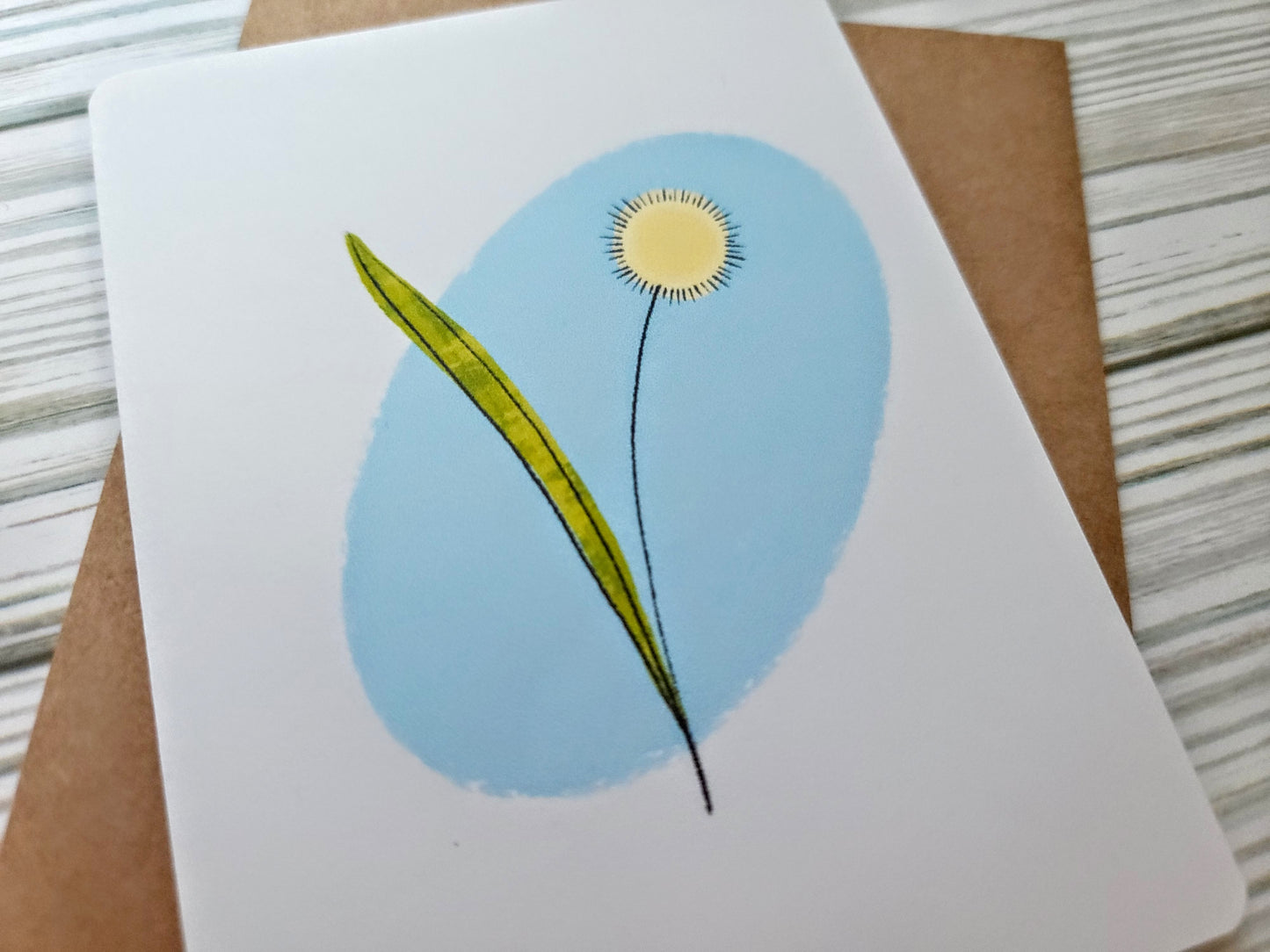 Dandelion Handmade Greeting Card - Recycled Paper and Kraft Envelope - Angled Overhead Shot