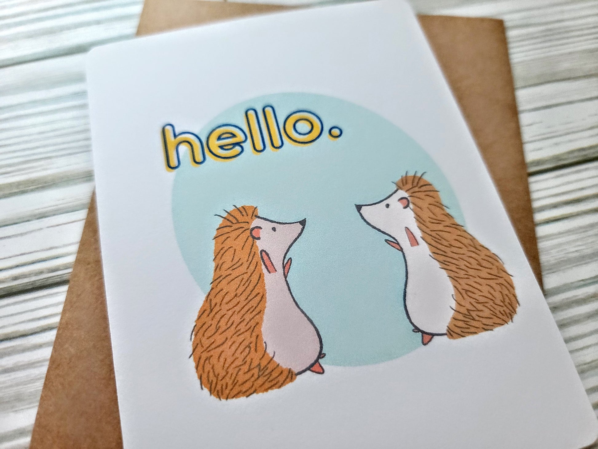 Hedgehog Hello Handmade Greeting Card - Recycled Paper and Kraft Envelope - Angled Overhead Shot
