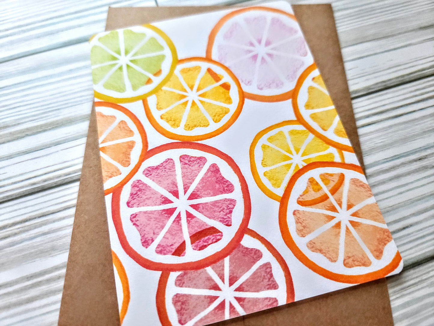 Citrus Slices Handmade Greeting Card - Recycled Paper and Kraft Envelope - Angled Overhead Shot