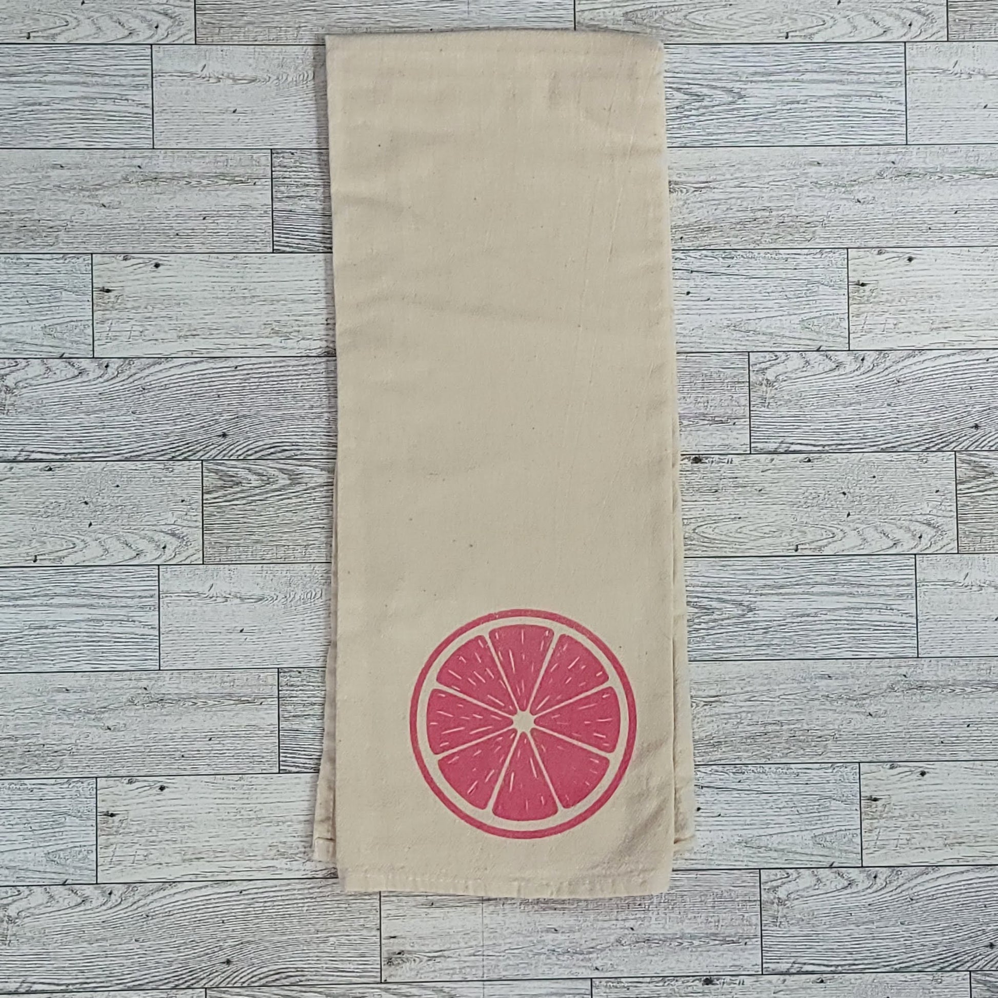 Red Citrus Slice Screen Printed Tea Towel - Folded Shot