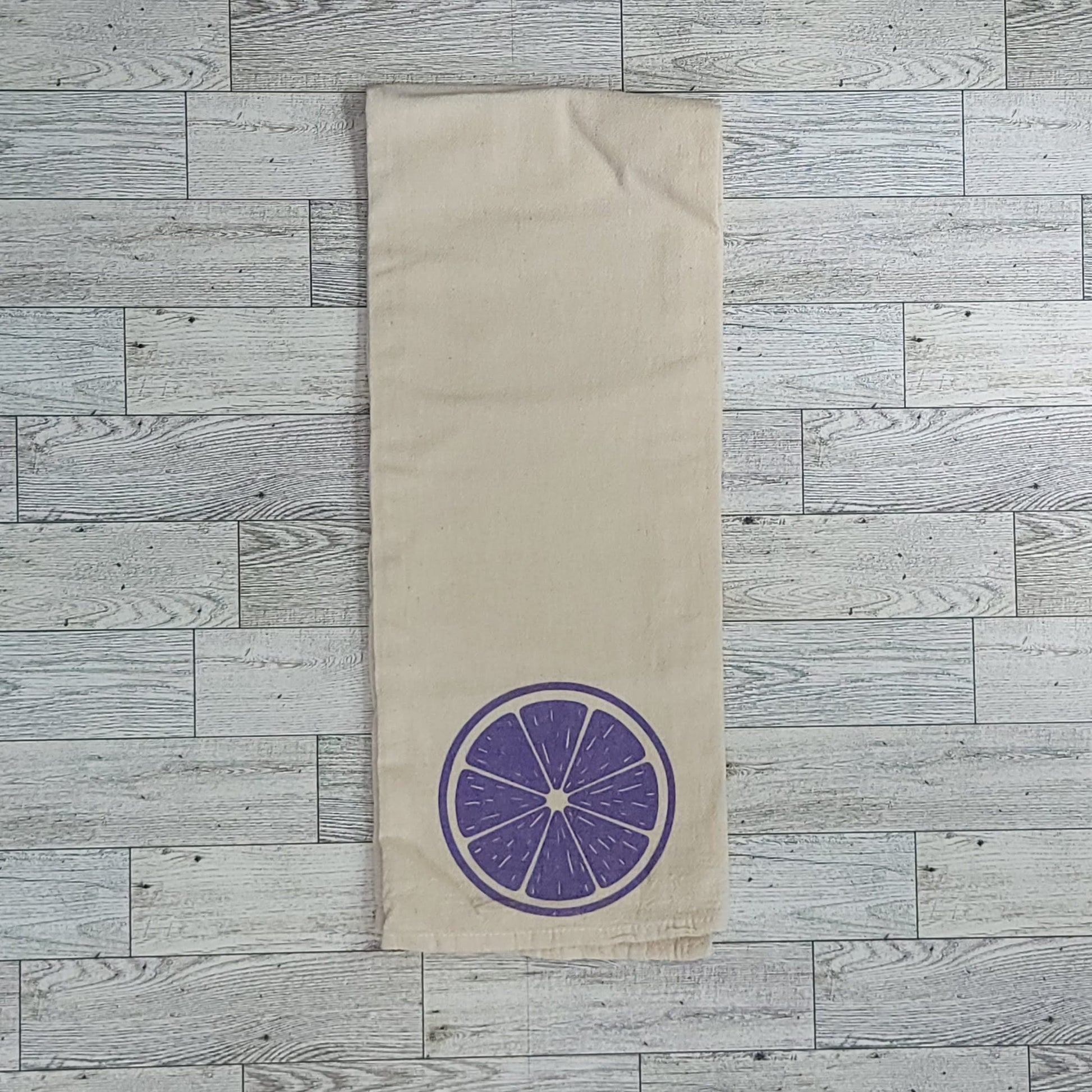 Purple Citrus Slice Screen Printed Tea Towel - Folded Shot
