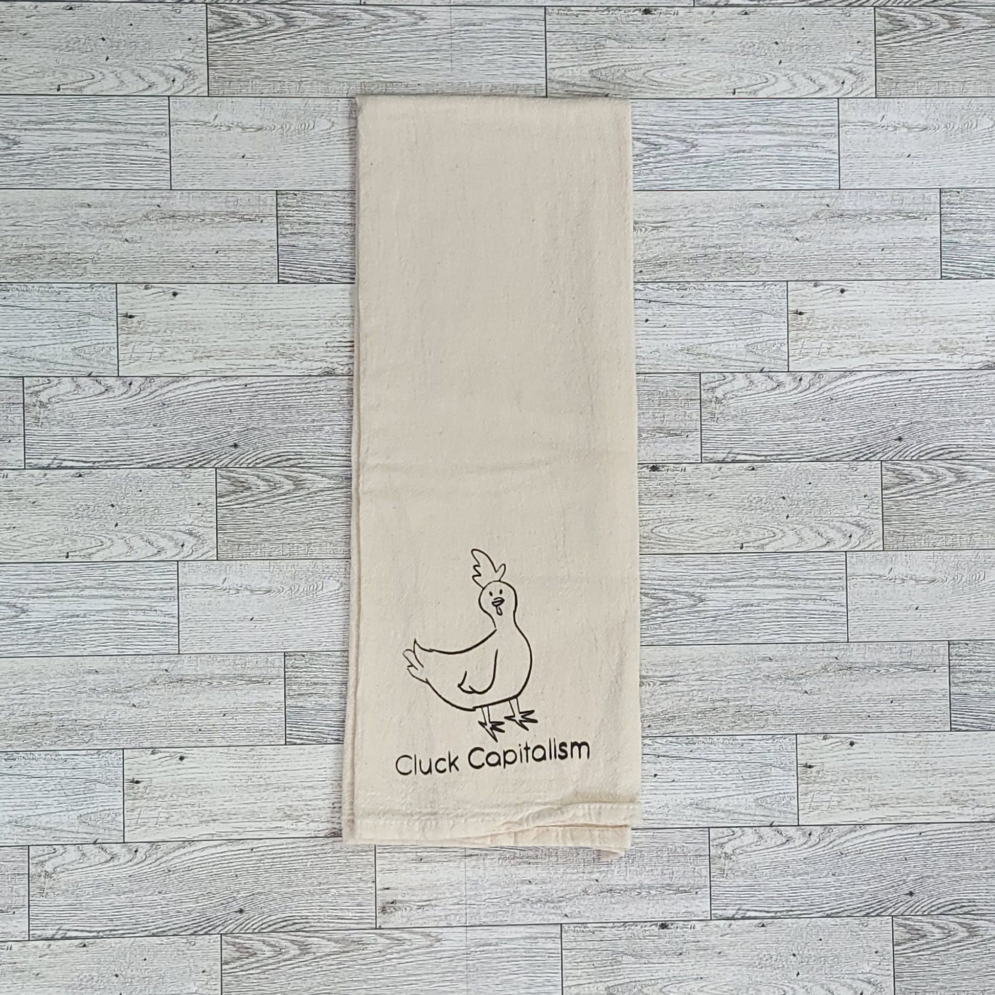 Cluck Capitalism Chicken Screen Printed Tea Towel - Square Folded Shot