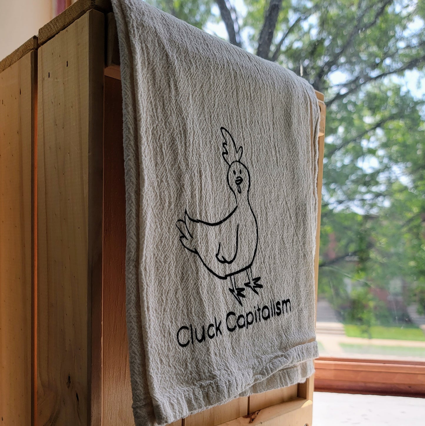 Cluck Capitalism Chicken Screen Printed Tea Towel - Hanging Shot