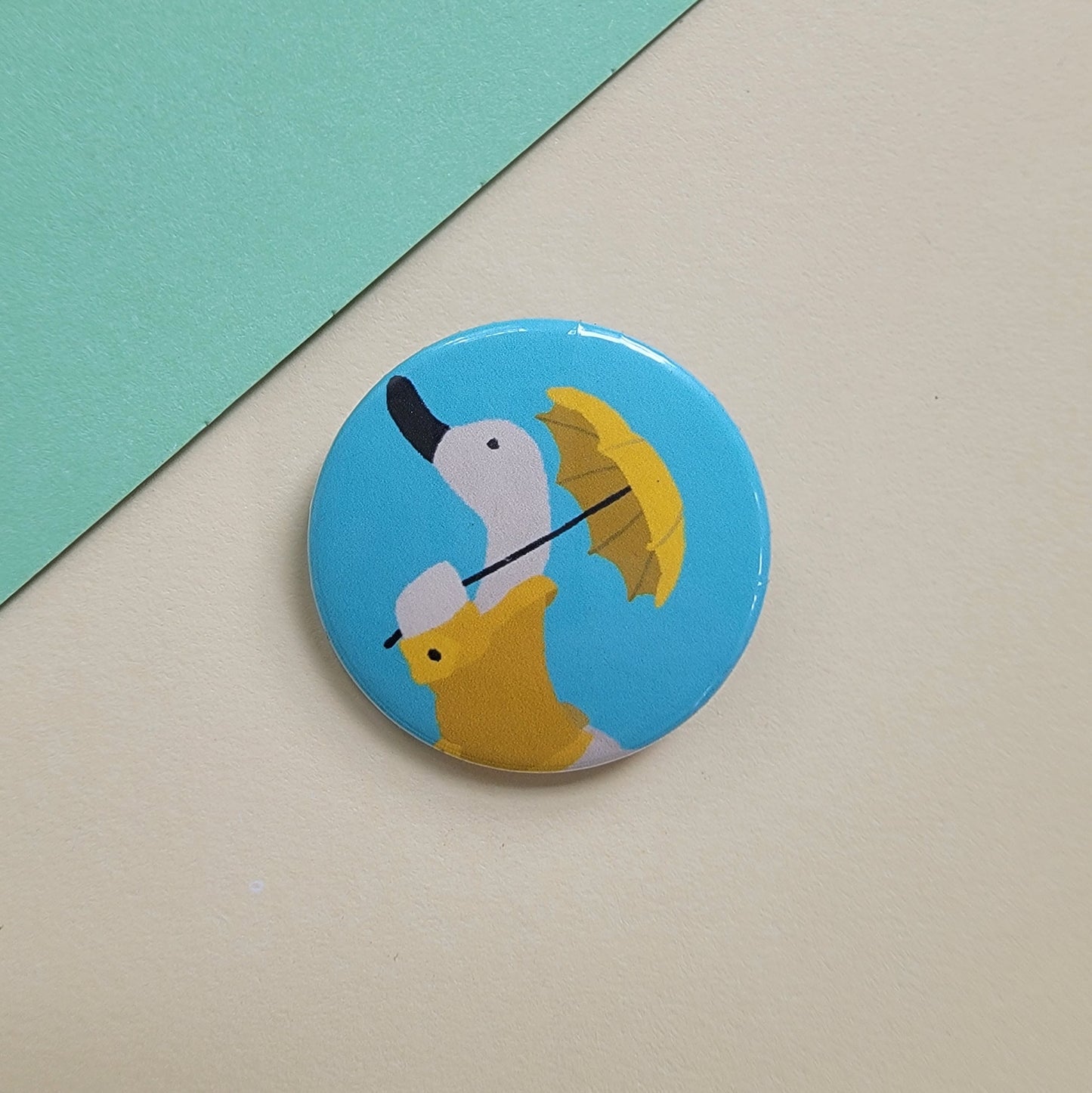 Duck in a Yellow Rain Coat with Umbrella 1.25 in Button
