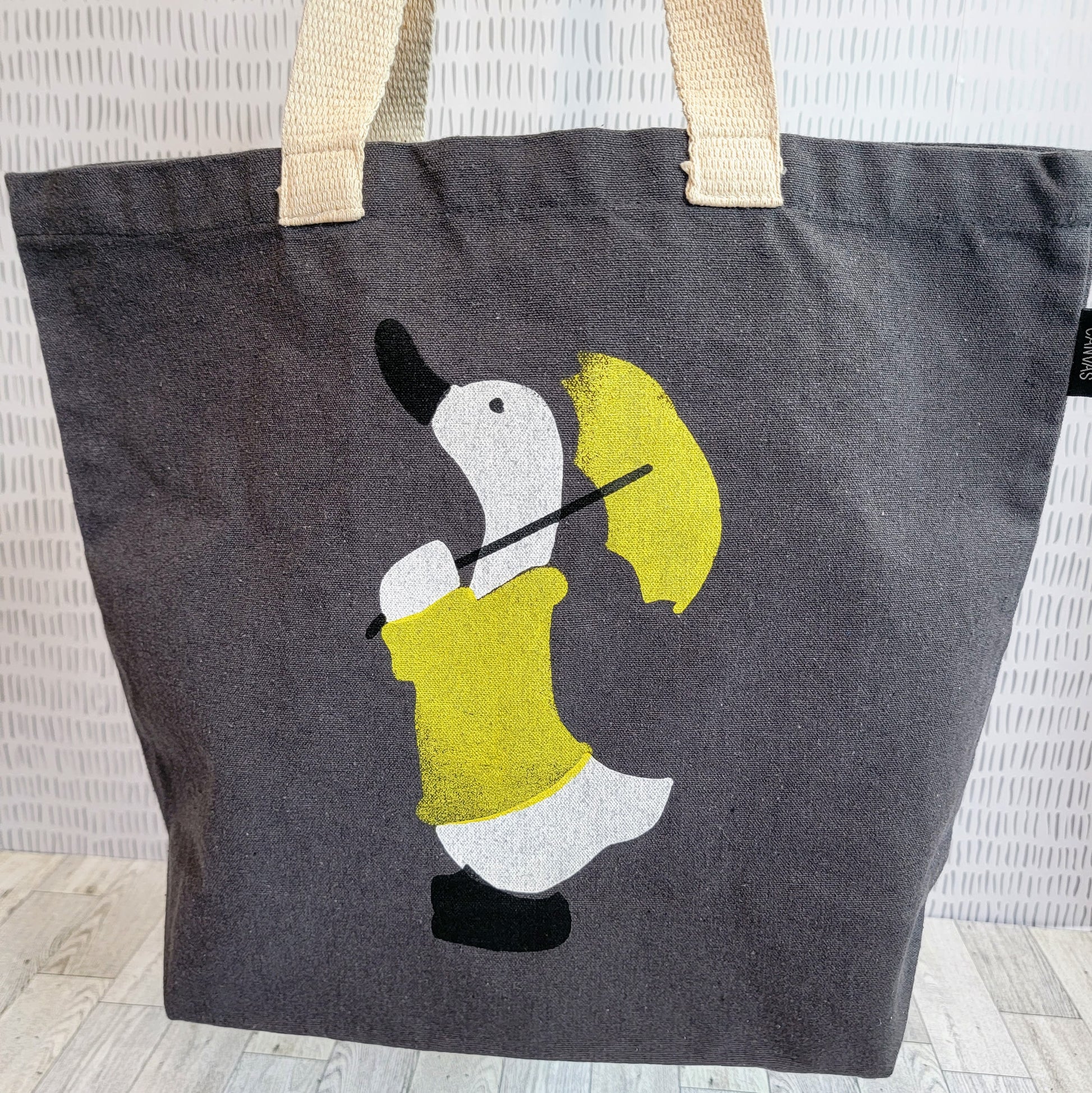 Duck in a Yellow Raincoat with matching Umbrella Dark Grey Recycled Canvas Tote Bag - Front Shot