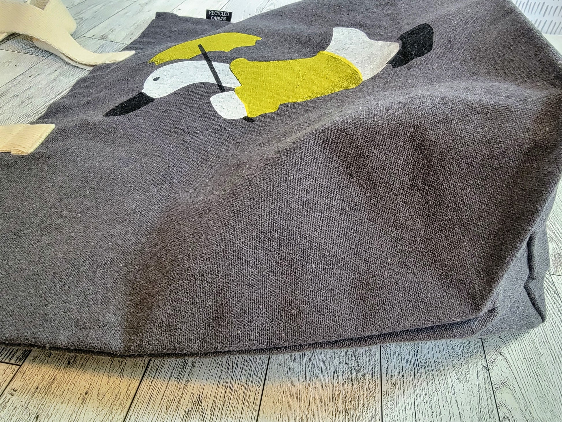 Duck in a Yellow Raincoat with matching Umbrella Dark Grey Recycled Canvas Tote Bag - Side Shot