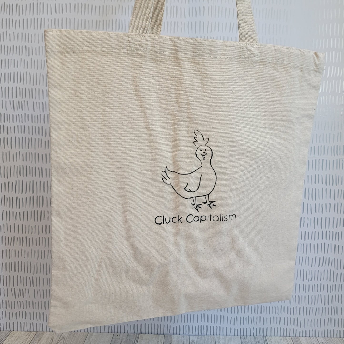 Cluck Capitalism Chicken Screen Printed Canvas Tote - Hanging Shot