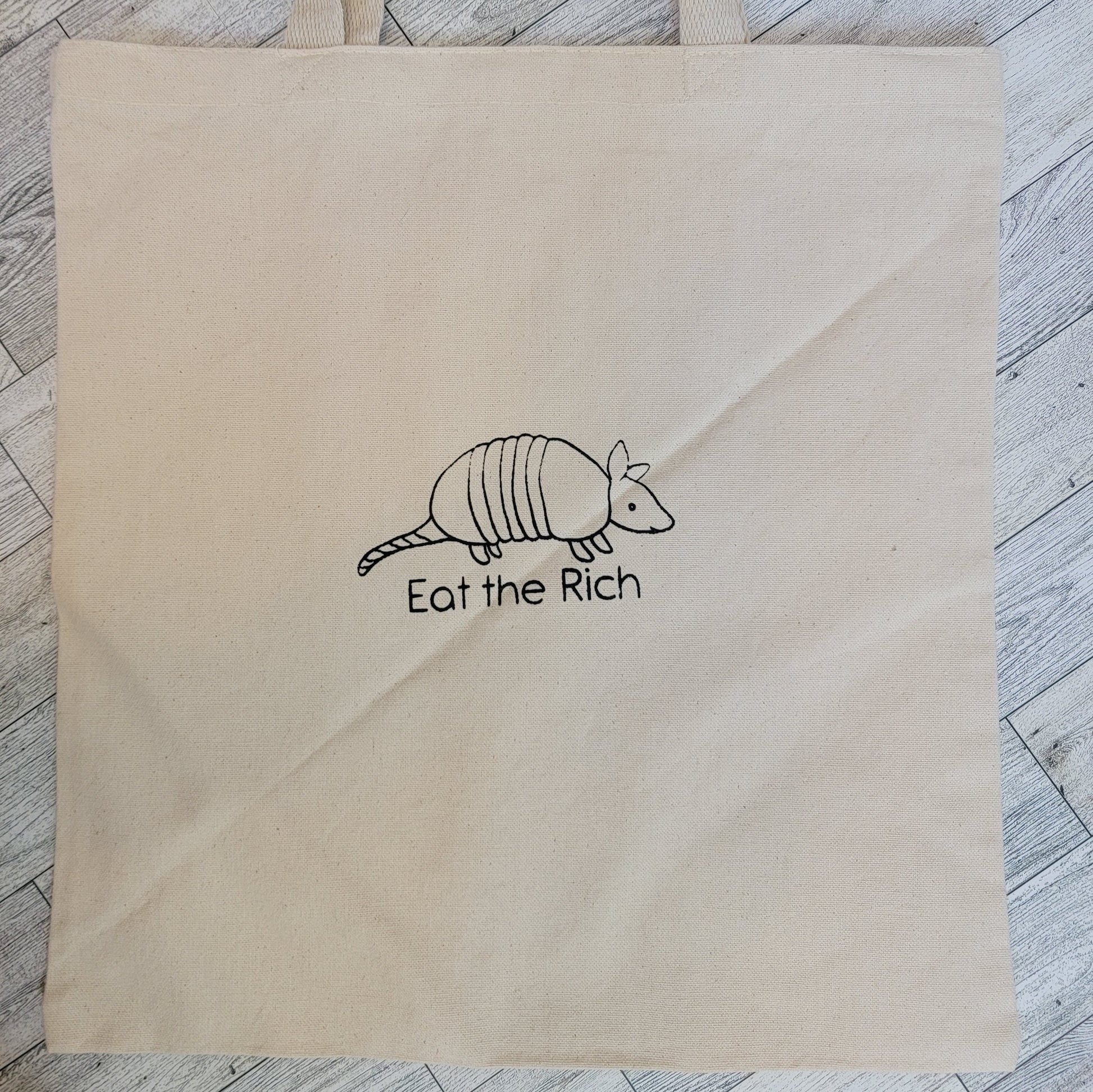 Eat the Rich Armadillo Screen Printed Canvas Tote Bag - Overhead Shot