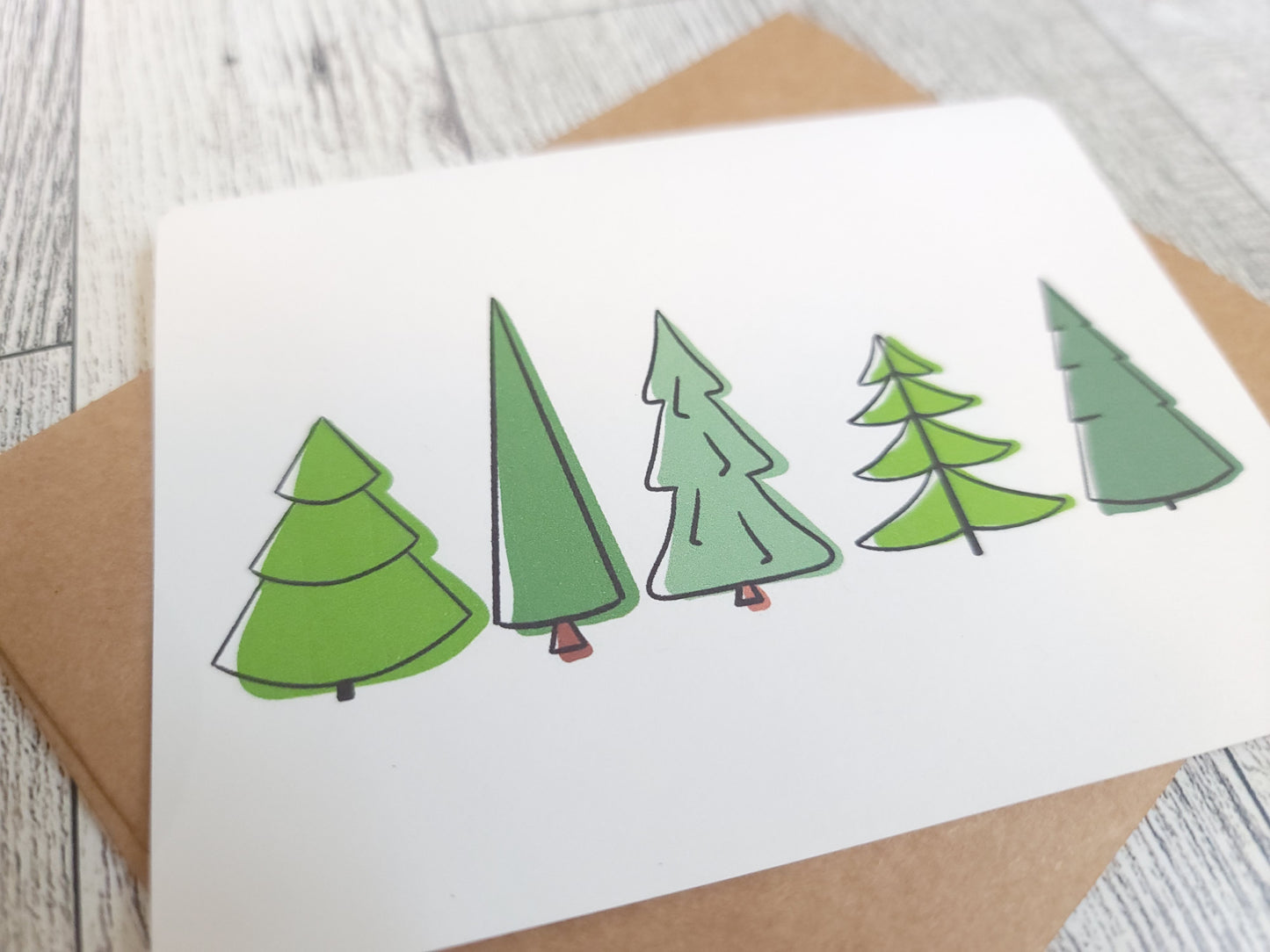 Pine Trees Handmade Greeting Card - Recycled Paper and Kraft Envelop - Angled Overhead Shot